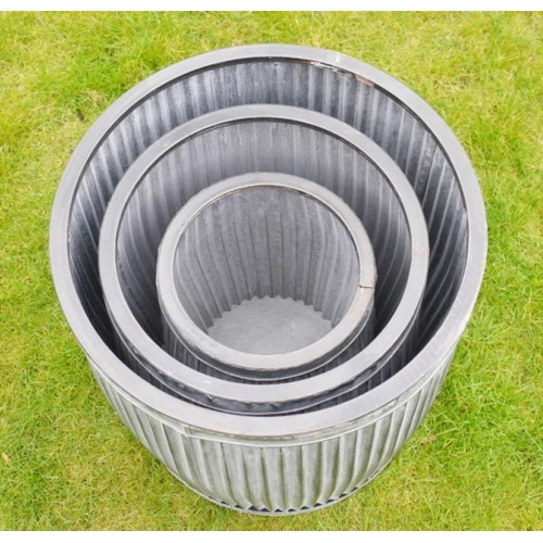 472 - GARDEN PLANTERS, a graduated set of three, galvanised metal, 50cm x 45cm x 45cm. (3)