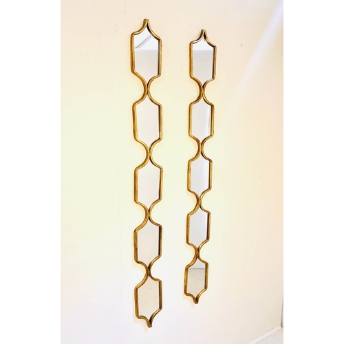 485 - ACCENT WALL MIRRORS, a pair, gilt frames,  144cm x 14cm.