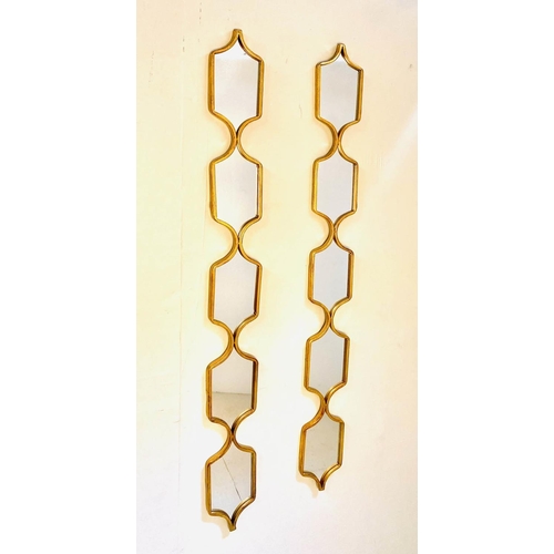 485 - ACCENT WALL MIRRORS, a pair, gilt frames,  144cm x 14cm.