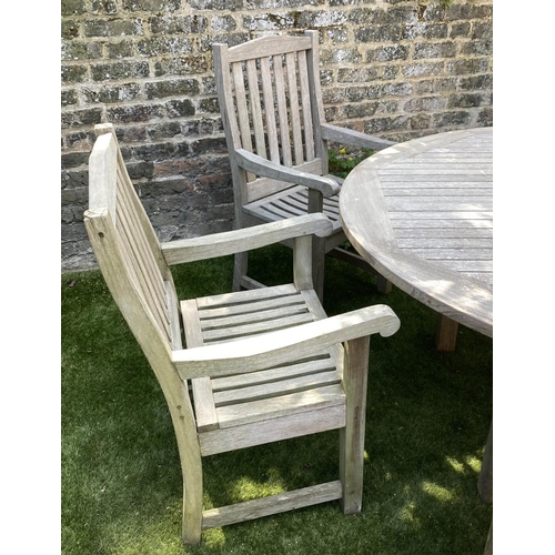 489 - CIRCULAR GARDEN TABLE AND CHAIRS, silvery weathered teak, including a set of six armchairs by Lister... 