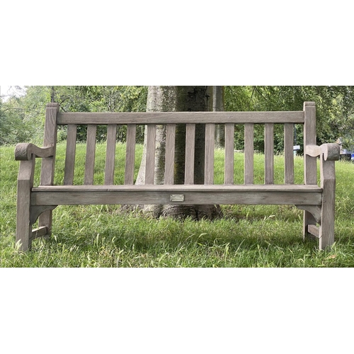 493 - LISTER GARDEN BENCH, well weathered teak of Country House proportions, slatted with scroll arms, R A... 