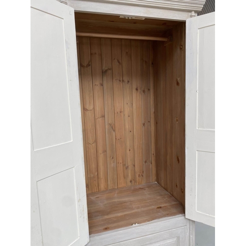 121 - ARMOIRE, traditionally grey painted with two panelled doors enclosing hanging space above a single d... 