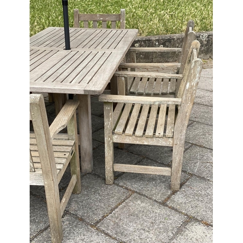 123 - GARDEN TABLE AND CHAIRS, well weathered teak with rectangular table by Lister together with six flat... 