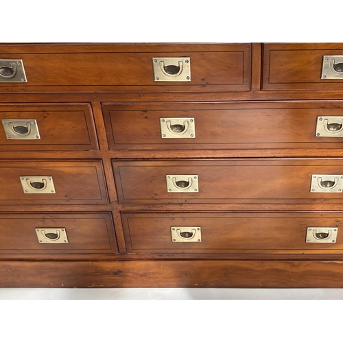 132 - CAMPAIGN STYLE LOW CHEST, yewwood and brass bound with nine drawers, 150cm x 43cm x 70cm H.