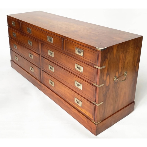 132 - CAMPAIGN STYLE LOW CHEST, yewwood and brass bound with nine drawers, 150cm x 43cm x 70cm H.