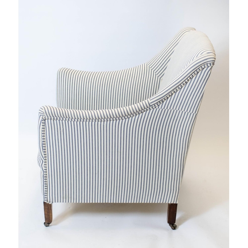 180 - ARMCHAIR, Edwardian in ticking with steel castors, 85cm H x 61cm.