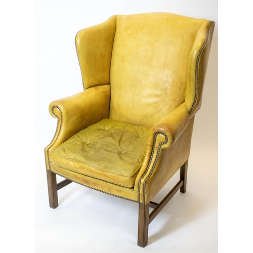 182 - WING ARMCHAIR, 111cm H x 82cm, Georgian style in tan leather.