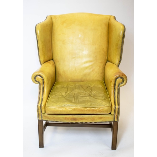 182 - WING ARMCHAIR, 111cm H x 82cm, Georgian style in tan leather.