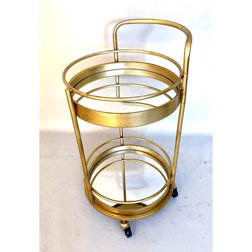 384 - COCKTAIL TROLLEY, 77cm high, 42cm diameter, 1960s French style, mirrored glass tiers, gilt metal fra... 