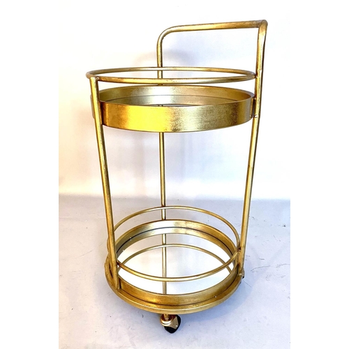 384 - COCKTAIL TROLLEY, 77cm high, 42cm diameter, 1960s French style, mirrored glass tiers, gilt metal fra... 