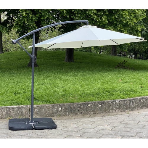 125 - GARDEN PARASOL, circular cream canvas retractable wind up with frame and weights (water filled), 30c... 