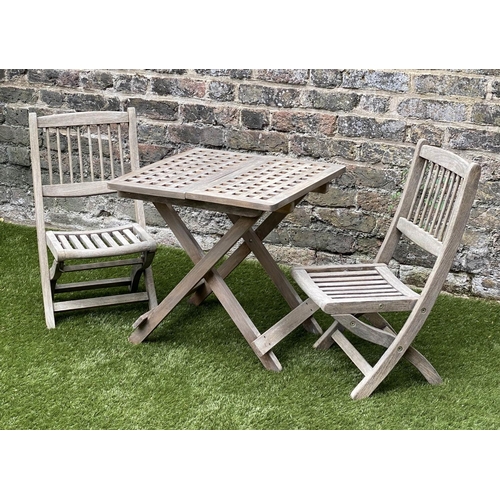 129 - CHILD'S GARDEN ARMCHAIRS, a pair, weathered teak, folding with spindle back together with a lattice ... 