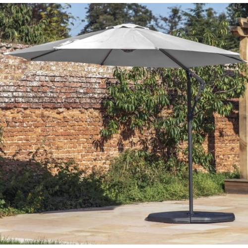 414 - CANTILEVERED GARDEN PARASOL, grey fabric, includes base, 300cm x 245cm H x 300cm.