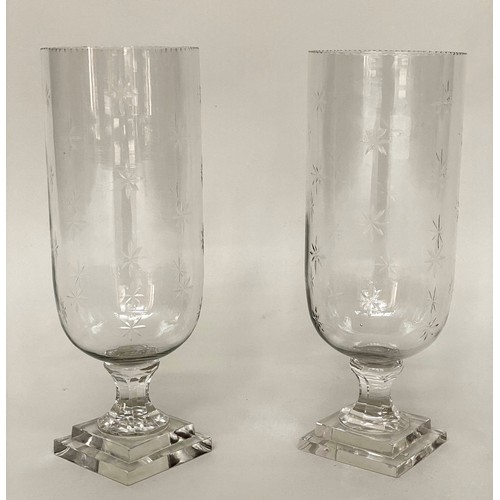 119 - STORM LANTERNS, a pair, cut glass cylindrical with engraved detail and stepped base, 40cm H. (2)