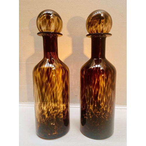 393 - DECANTERS, a pair, 53cm high, 14cm diameter, Murano style tortoiseshell glass, cylindrical form. (2)