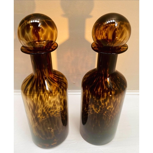 393 - DECANTERS, a pair, 53cm high, 14cm diameter, Murano style tortoiseshell glass, cylindrical form. (2)