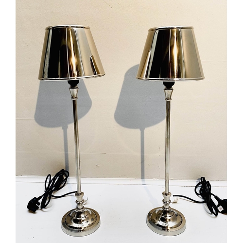 395 - LIBRARY TABLE LAMPS, a pair, 64cm high, 20cm diameter, polished metal, with shades. (2)