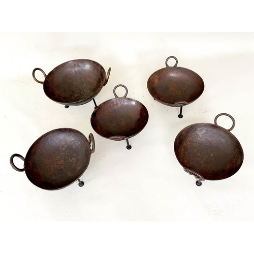 397 - INDIAN STYLE KADAI FIRE BOWLS ON STANDS, a set of five, 46cm diam. at largest, of various sizes. (5)