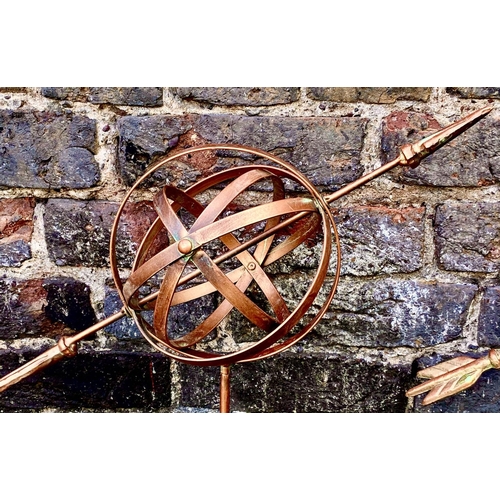 383 - ARMILLARY SPHERE GARDEN STAKES, a set of three, 115cm H x 39cm W x 17cm D, coppered metal finish. (3... 