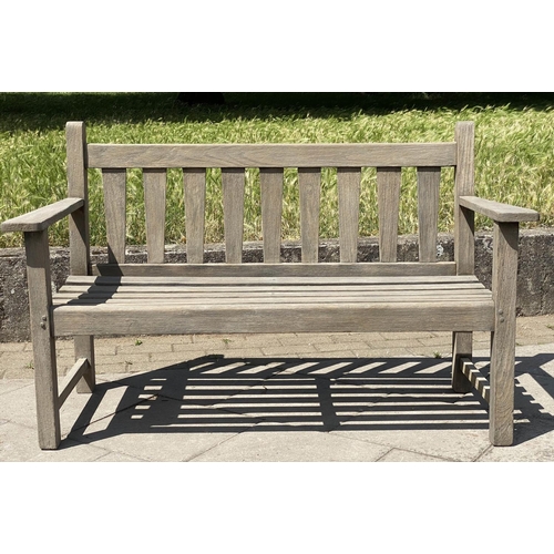 126 - GARDEN BENCH, weathered teak with triangular splat back, 140cm W.