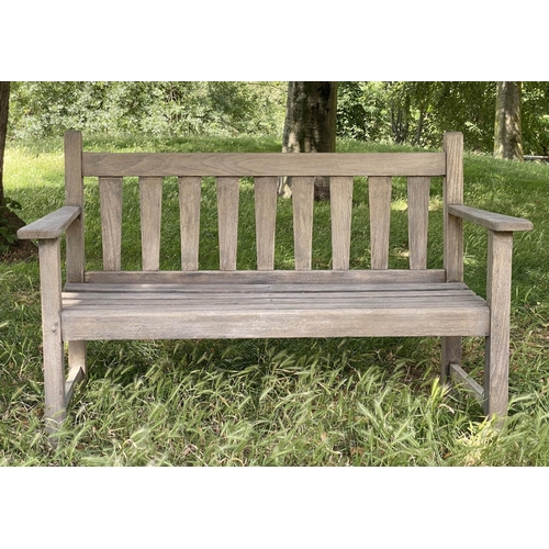 126 - GARDEN BENCH, weathered teak with triangular splat back, 140cm W.