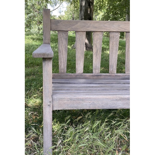 126 - GARDEN BENCH, weathered teak with triangular splat back, 140cm W.