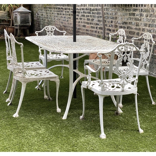 127 - GARDEN TABLE AND CHAIRS, weathered cast aluminium with pierced table and six matching chairs, one wi... 