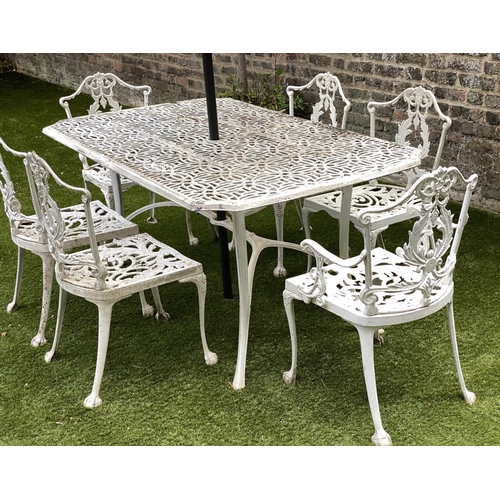 127 - GARDEN TABLE AND CHAIRS, weathered cast aluminium with pierced table and six matching chairs, one wi... 