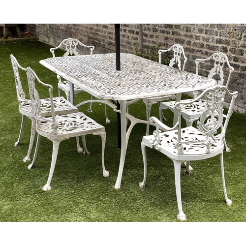 127 - GARDEN TABLE AND CHAIRS, weathered cast aluminium with pierced table and six matching chairs, one wi... 