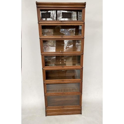 76 - GLOBE WERNICKE BOOKCASE, early 20th century oak comprising seven graduated glazed sections with corn... 