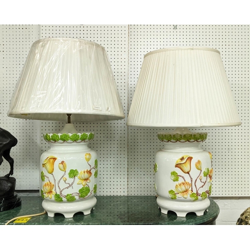 345 - TABLE LAMPS, a pair, 72cm H, glazed ceramic with floral relief design, with pleated shades. (2)