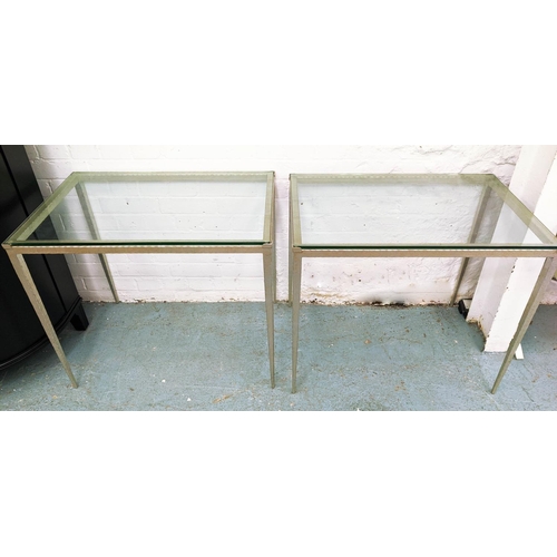 454 - ADAM WILLIAMS TAPERED SIDE TABLES, a pair,  75.5cm x 50.5cm x 64cm, silvered metal bases, glass top.... 