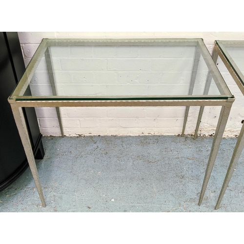 454 - ADAM WILLIAMS TAPERED SIDE TABLES, a pair,  75.5cm x 50.5cm x 64cm, silvered metal bases, glass top.... 