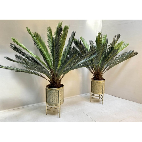 436 - FAUX FERN TREES, a pair, 130cm high, in gilt metal planters. (2)