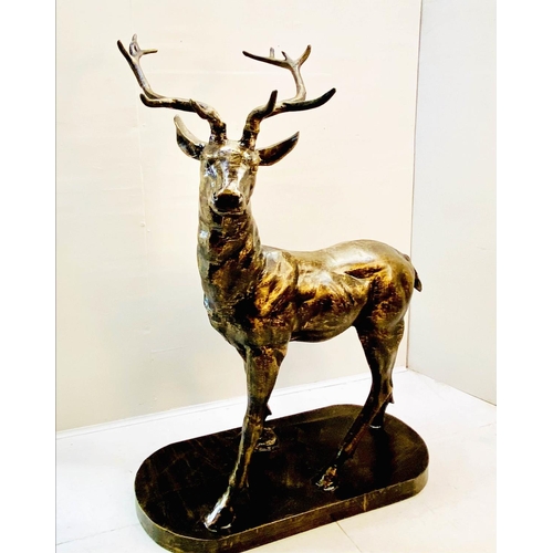 417 - SCULPTURAL STAG, 154cm high, 105cm wide, 50cm deep, cast metal, bronzed finish.