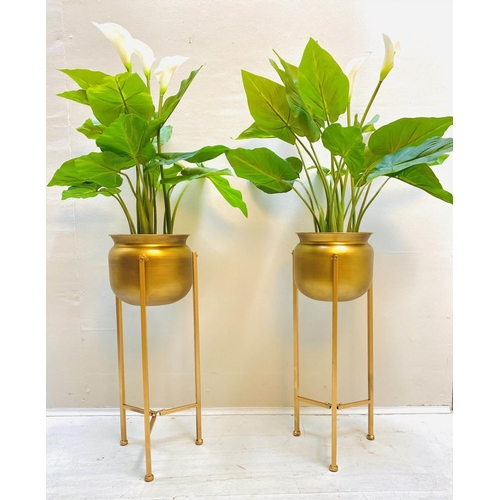 418 - FAUX PRAYER LILY PLANTS, a pair, in gilt metal planters with tripod bases, 110cm H. (2)