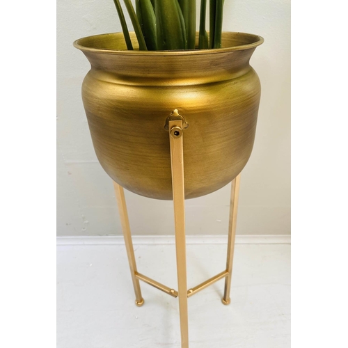 418 - FAUX PRAYER LILY PLANTS, a pair, in gilt metal planters with tripod bases, 110cm H. (2)