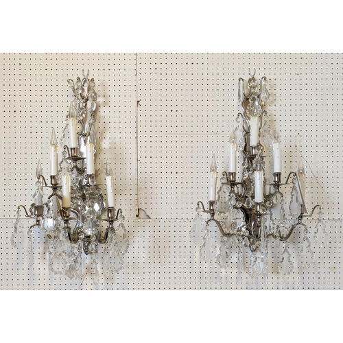 117 - WALL SCONCES, a pair, each approx 65cm H with polished metal frames and cut glass droplets. (2)