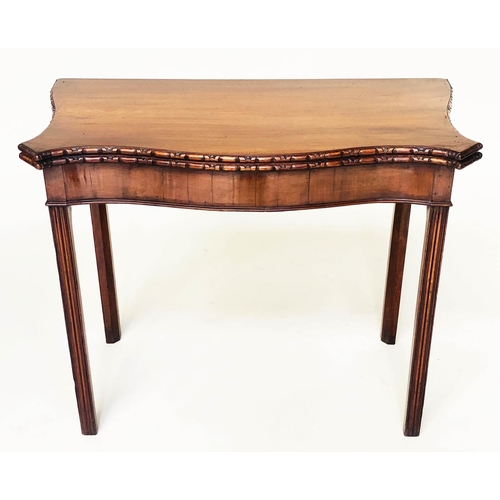 128 - TEA TABLE, George III figured mahogany of serpentine outline, carved edge, and fold over top, 91cm W... 