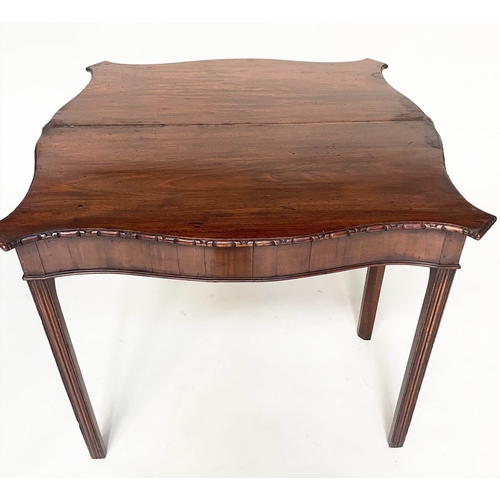 128 - TEA TABLE, George III figured mahogany of serpentine outline, carved edge, and fold over top, 91cm W... 