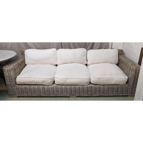 467 - GARDEN SOFA, 228cm L x 69cm H x 90cm D three seater wicker with loose cream seat cushions.