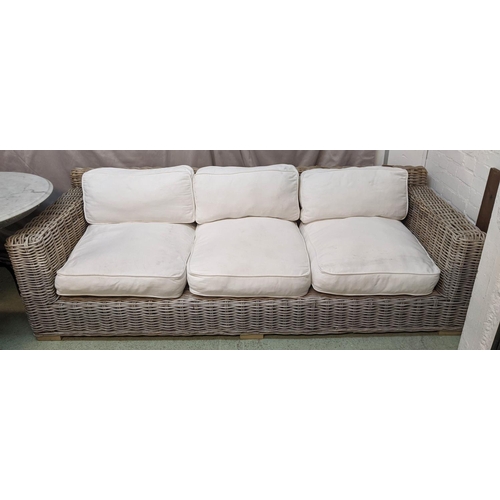 467 - GARDEN SOFA, 228cm L x 69cm H x 90cm D three seater wicker with loose cream seat cushions.