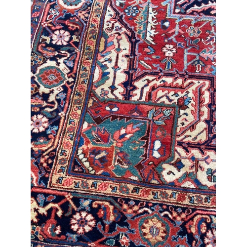 55 - ANTIQUE PERSIAN HERIZ CARPET, 314cm x 230cm.