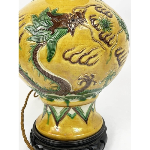 6 - CHINESE SANCAI VASE, incised decorated with a five claw dragon chasing the flaming pearl of wisdom a... 