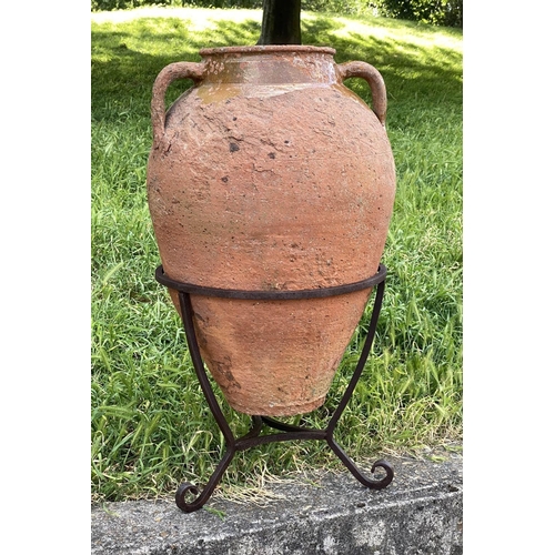 130 - OLIVE JAR ON STAND, antique Mediterranean terracotta on wrought iron stand, 80cm H.