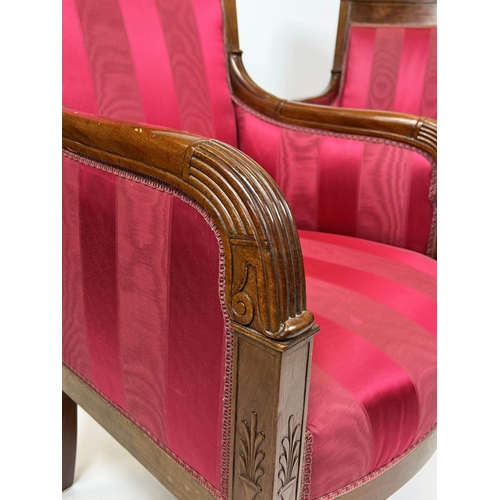 121 - BERGERES, a near pair, each 60cm x 93cm H, Restauration period, circa 1820, in striped red fabric wi... 