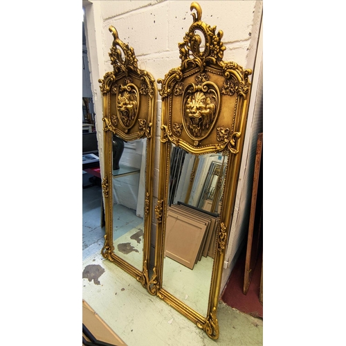 342 - WALL PIER MIRRORS, a pair, 178cm x 58cm, Belle Époque style, gilt frames with lion head detail. (2)