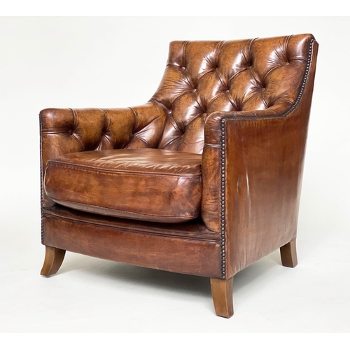 106 - ARMCHAIR AND STOOL, deep buttoned mid brown leather and brass studded upholstered with swept support... 