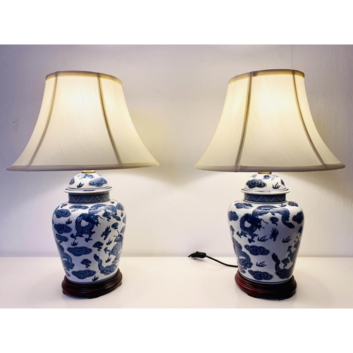 363 - TABLE LAMPS, 60cm H x 40cm diam., a pair, Chinese Export style blue and white ceramic, with  cream s... 