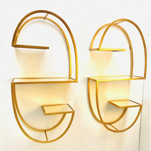 373 - WALL ETAGERES, a pair, 122cm H x 60cm W x 24cm D, mirrored glass shelves, gilt metal frames. (2)